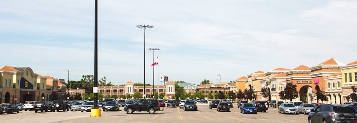 A parking lot with lighting poles